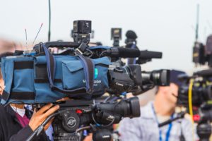 press coverage: news cameras covering a live event