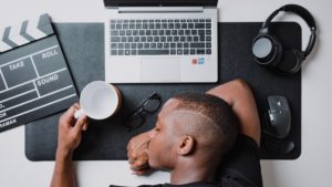 Workaholism: a man at sleep at his desk